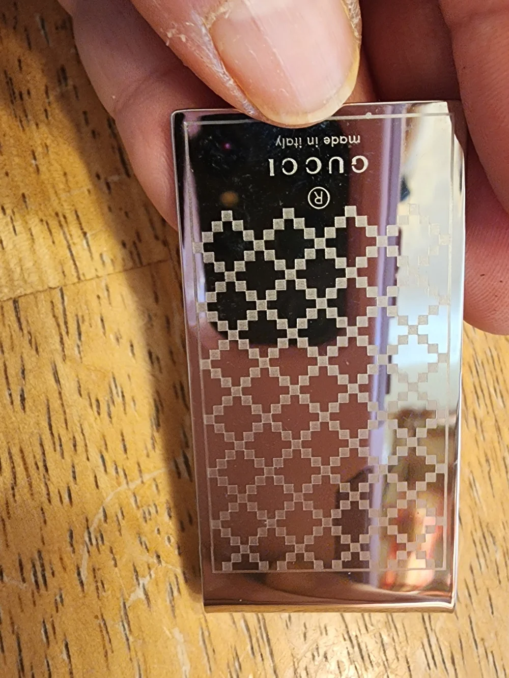 Gucci Diamante money clip featuring the signature diamond pattern and engraved
